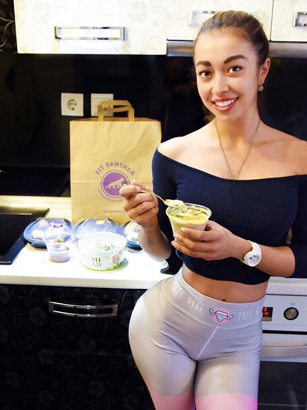 girl model is eating healthy food from Fit Panther