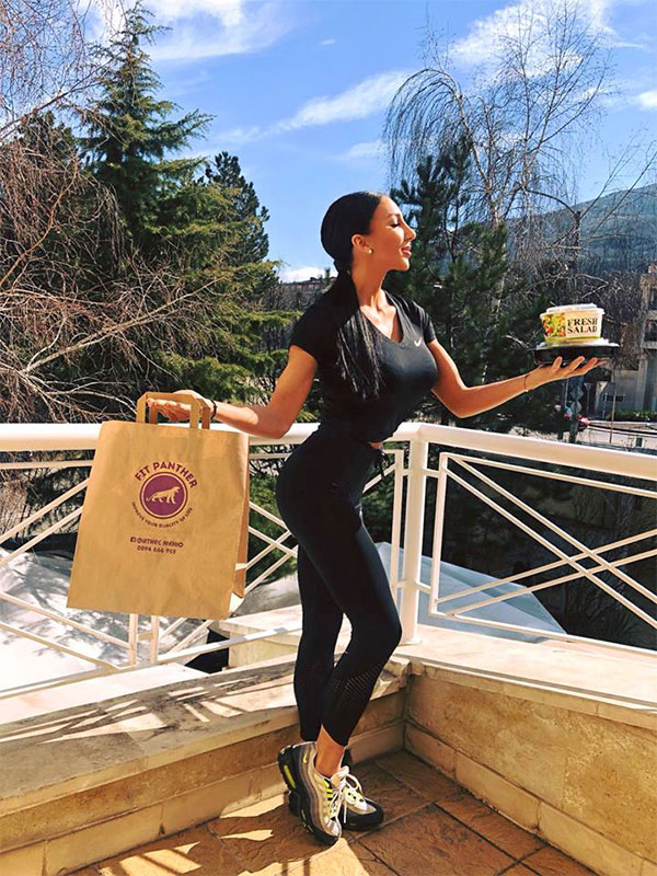 girl with a sport figure and a package of food from Fit Panther