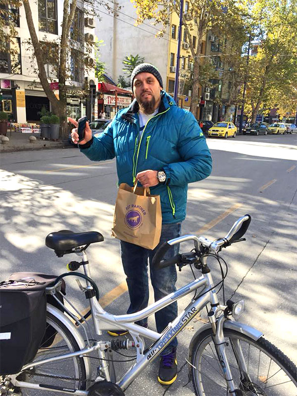 satisfied client with his wheel and a package of food from Fit Panther
